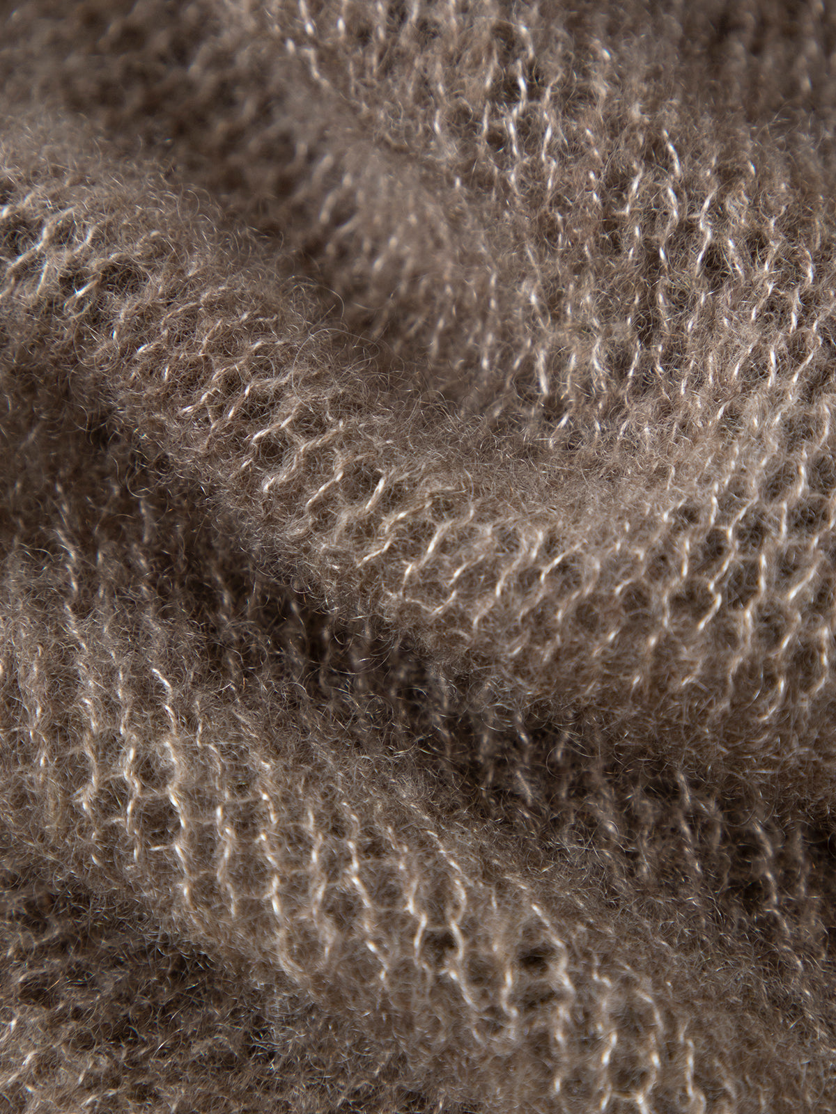 Close-up of textured brown fabric with a wavy pattern