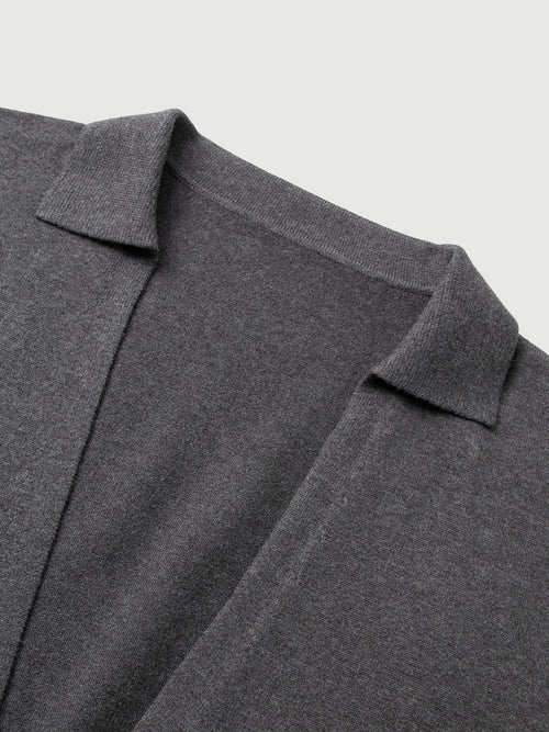 Load image 1 in gallery view. Close-up of a gray sweater with a collar on a light gray background
