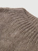 Close-up of a textured brown fabric surface