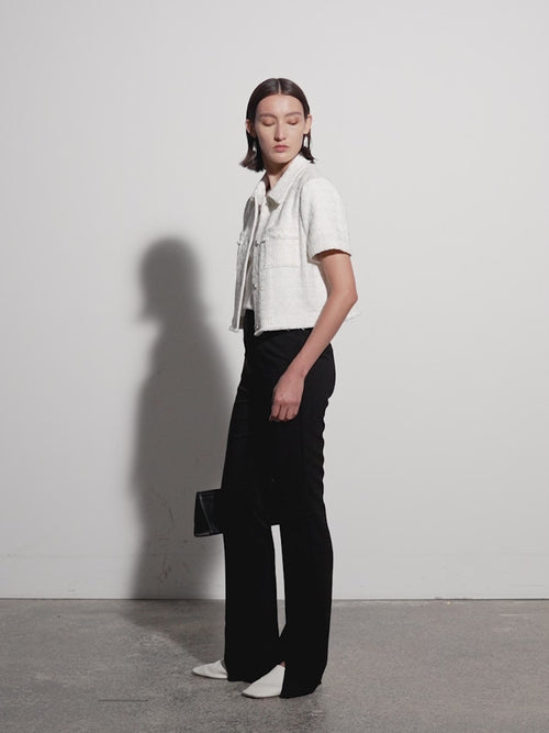 Load image 1 in gallery view. Black slim fit pants with a high waist and a slightly flared leg